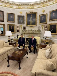 Trump sits in his gold-encrusted Oval Office with Chinese President Xi Jinping