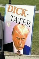 Protest sign with a picture of Donald Trump and the words 'Dick-Tater'