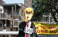 Caricature of Donald Trump with a sign reading 'Liar'