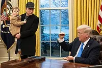 Elon Musk addresses the nation while Donald Trump sits idly by