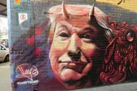 Graphiti showing Donald Trump as the devil